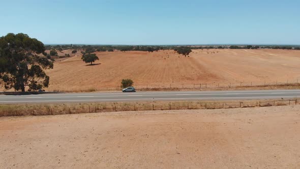 Car Is Standing on the Side of a Desert Road, 