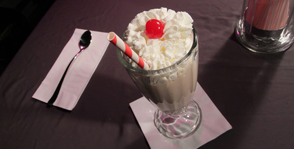 Pouring A Chocolate Milkshake
