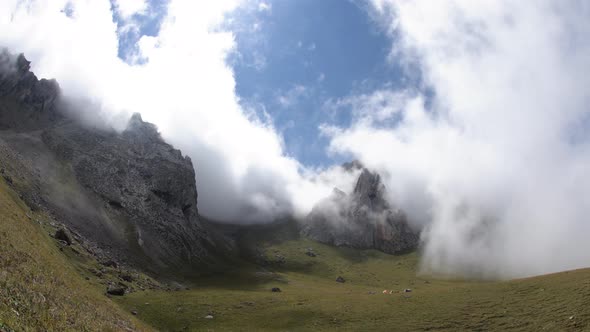 Time Lapse of Clouds Over Mountain Tops