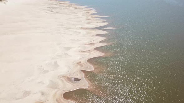 Drone shot of pattern in the river sand