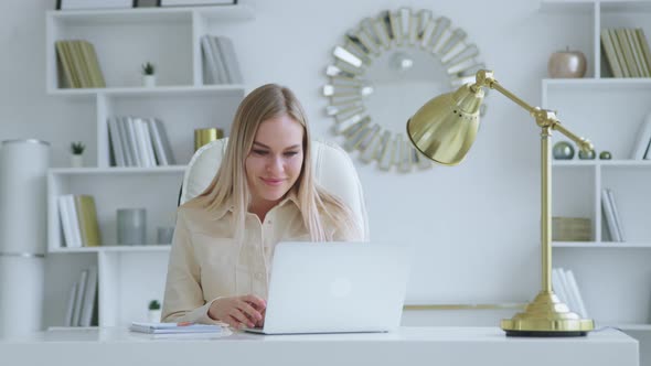 Smiling young girl communicating by video live, microphone and webcam