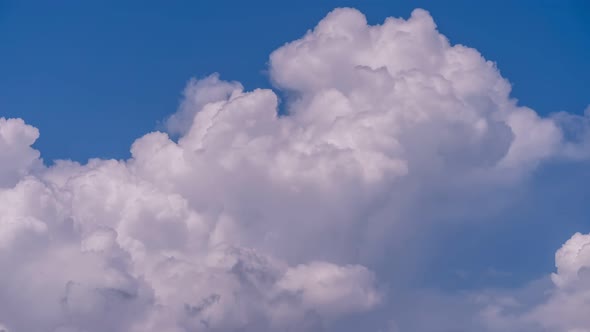 4K Amazing timelapse video of clouds. Blue sky white clouds. Fluffy white clouds. Cumulus cloud