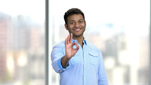 Young Smiling Man Showing Ok Sign