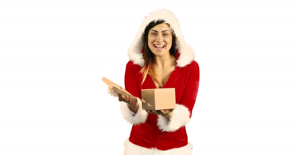 Sexy girl in santa costume opening a gift 4k