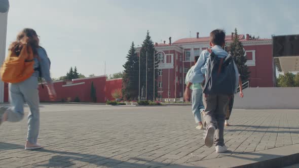 Excited Children Running To School