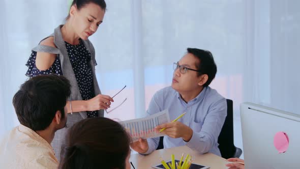 Unhappy Business People in Group Meeting After Project Failure