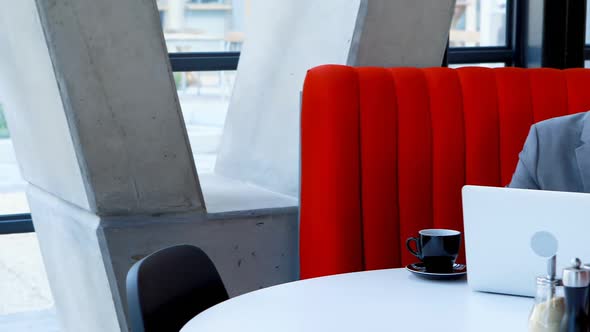 Businessman using mobile phone in hotel 4k