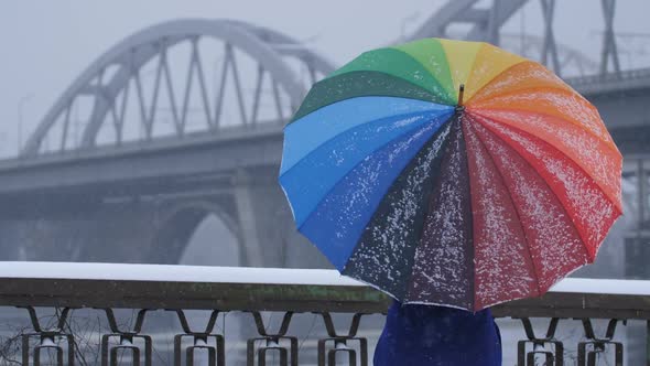 Spinning Rainbow Umbrella During Snow