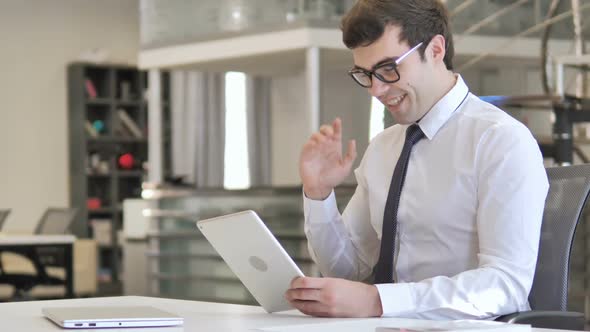 Businessman Doing Online Video Chat on Tablet