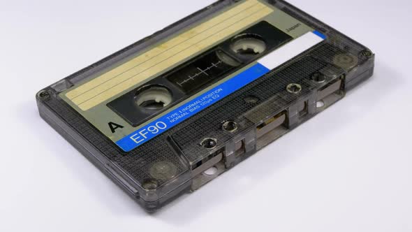 Vintage Audio Cassette Rotates on White Background