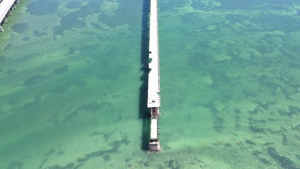 Aerial showing a slow upward pan of the Old Bahia Honda Railway Bridge