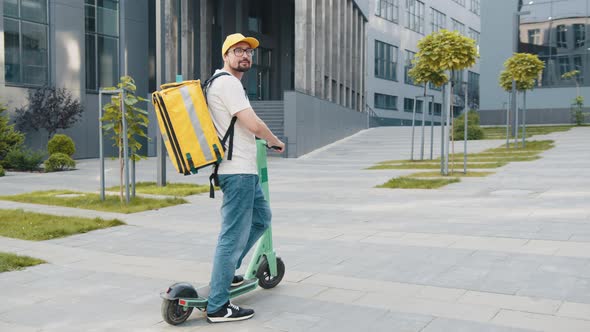 Portrait Shot of Man Delivery Worker Standing at Street and Turning Face to