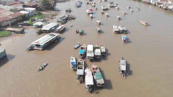 Aerial: flying over Cai Rang floating market Can Tho,  Vietnam