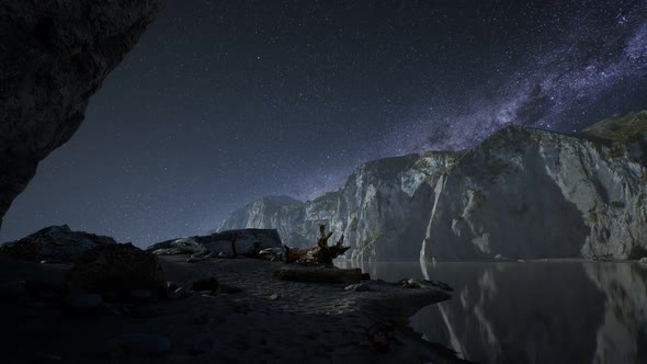 Hyperlapse of Night Starry Sky with Mountain and Ocean Beach in Lofoten Norway