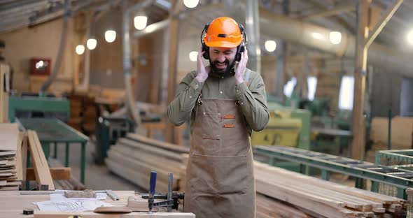 Carpentry Worker Having Fun at the Factory