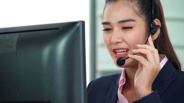 Business People Wearing Headset Working in Office