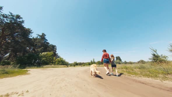 Family with Golden Retriever Dog Outside