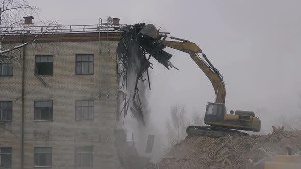 Excavator Demolishes Old Building Hydraulic Arm of Excavator Smashes Into Roof