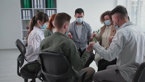 Religious Teaching Young Believers with Closed Eyes in Medical Masks with Faith in Their Heart and