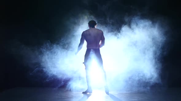 Full Length Silhouette of a Young Man Dancer, Smoke