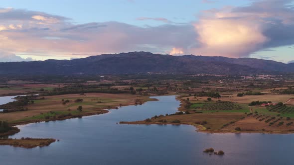 Lake drone aerial view of mountain panorama landscape at sunset in Marateca Dam in Castelo Branco, P