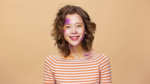 Portrait of Caucasian Brunette Woman with Art Spots on Face Expressions Mood Swings From Happiness