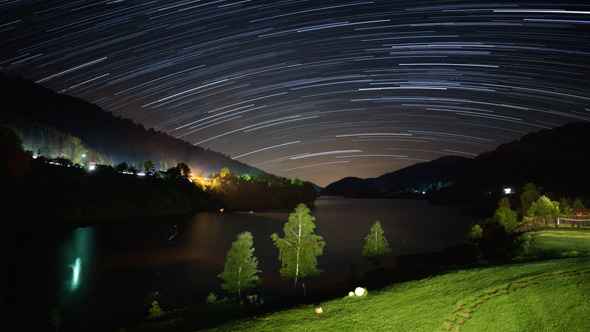 Star Trails over Lake in the Mountains