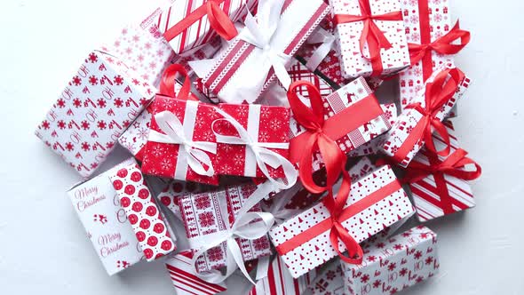 A Pile Various Size Wrapped in Festive Paper Boxed Gifts Placed on Stack. Christmas Concept