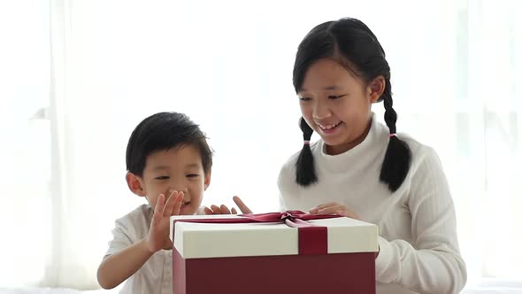 Cute Asian Children Opening Gift Present Box