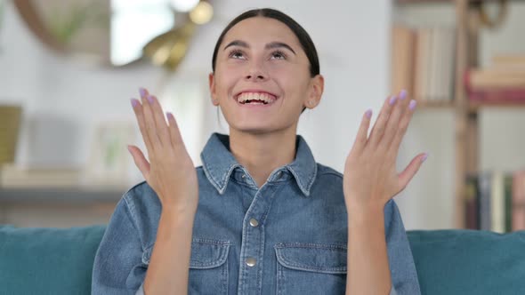 Excited Latin Woman Celebrating