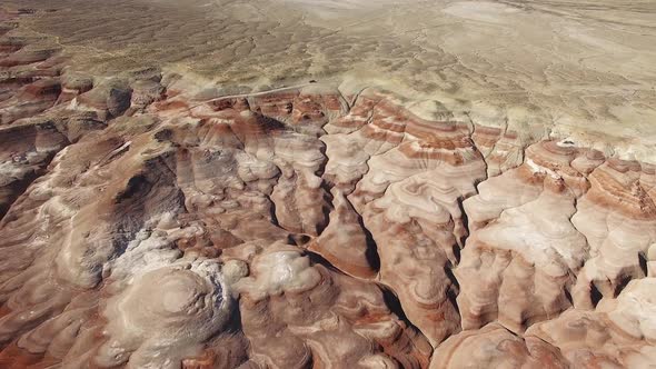 Flying in towards dirt road over Mars desert