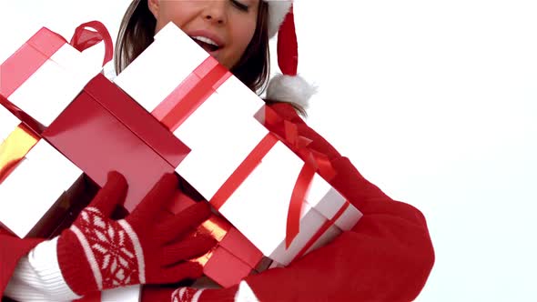 Happy woman holding load of gifts