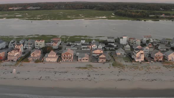 Well Beach real estate housing stretching along shoreline Sunrise aerial