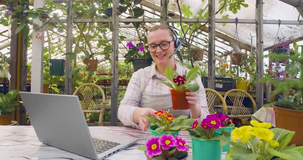 Young Woman in Glasses Giving a Floriculture Workshop Online