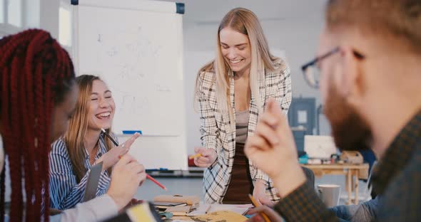 Professional Positive Female Leader Cooperating with Experienced Multiethnic Colleagues, Leading