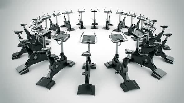 Gym equipment stationary bikes standing in the circular array. Loopable. HD