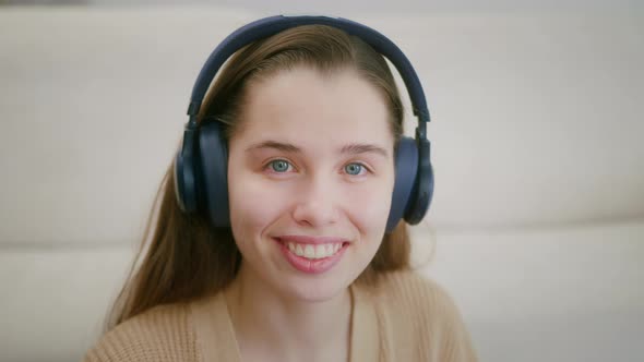 Portrait of Lovely Teenage Girl Wearing Headphones