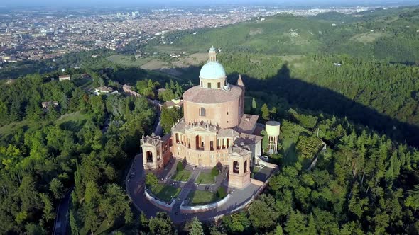 Sanctuary of the Blessed Virgin of Saint Luke in Bologna Italy during sundown, Aerial orbit reveal s