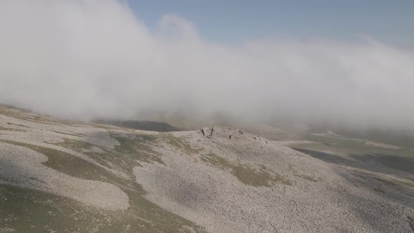 Scenic aerial view of moving white clouds at Abuli Mountain. Georgia