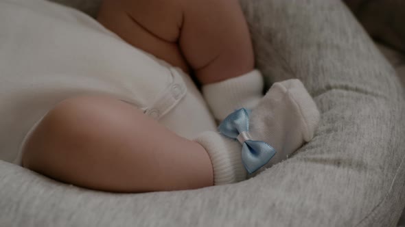 Tiny Newborn sleeping Baby's feet. Happy Family concept, selective soft focus.