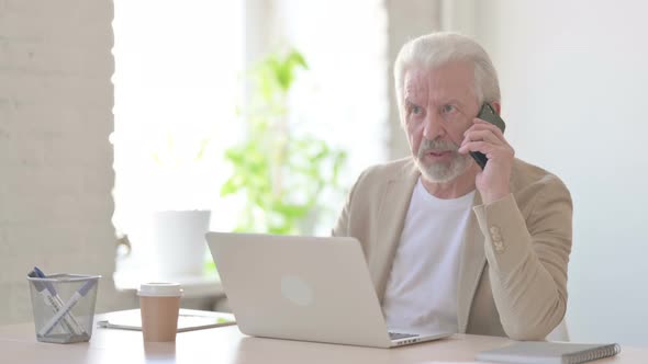 Angry Old Man Talking on Phone