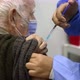 Medical Nurse is Making a Vaccine Injection to a Male Patient in a Health Clinic Coronavirus COVID - VideoHive Item for Sale