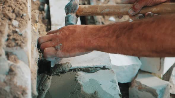 Construction Worker or Mason Laying Bricks and Creating Walls. Bricklayer Laying Bricks To Make a