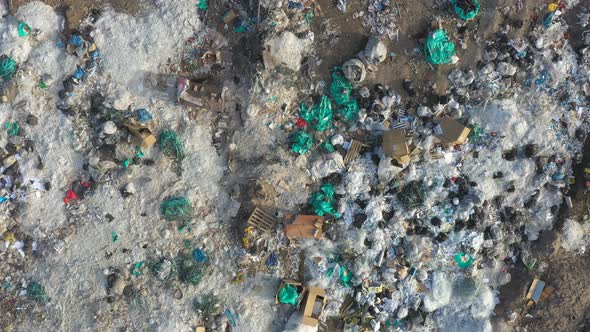 Aerial Shot of Rubbish Pile Lying Among Countryside, Flying Over Huge Dump Trash