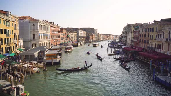 A lot of traffic on the main canal in Venice, the Canale Grande, seen from the famous Rialto Bridge.