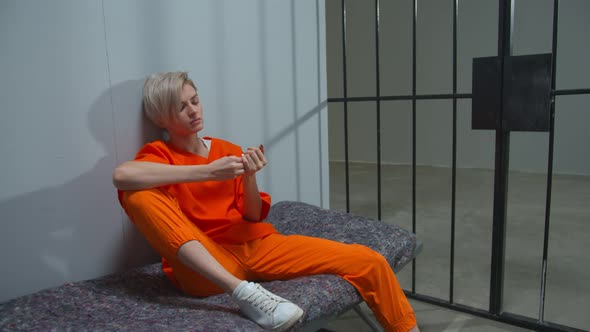 Woman Criminal Misses a Prison Cell. Medium Full Shot