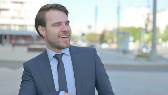 Young Businessman Dancing in Joy Outdoor