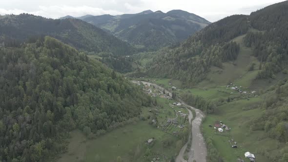 Ukraine, Carpathian Mountains: River in the Mountains. Aerial. Gray, Flat