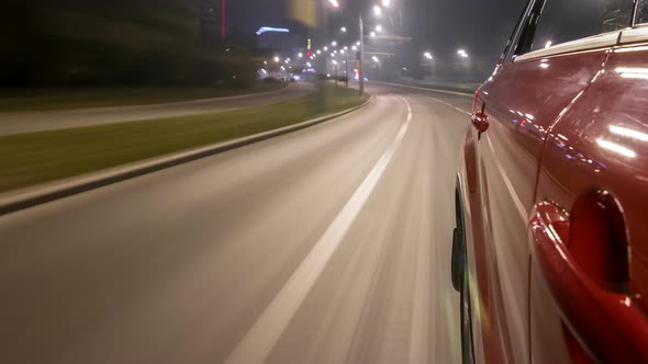 Drivelapse Urban Look From Fast Driving Car at a Night Avenue in a City Timelapse Hyperlapse