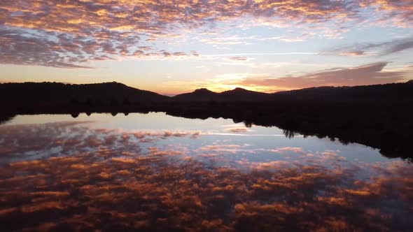 Aerial view of a beautiful sunrise in a lake in Calahorra, Spain